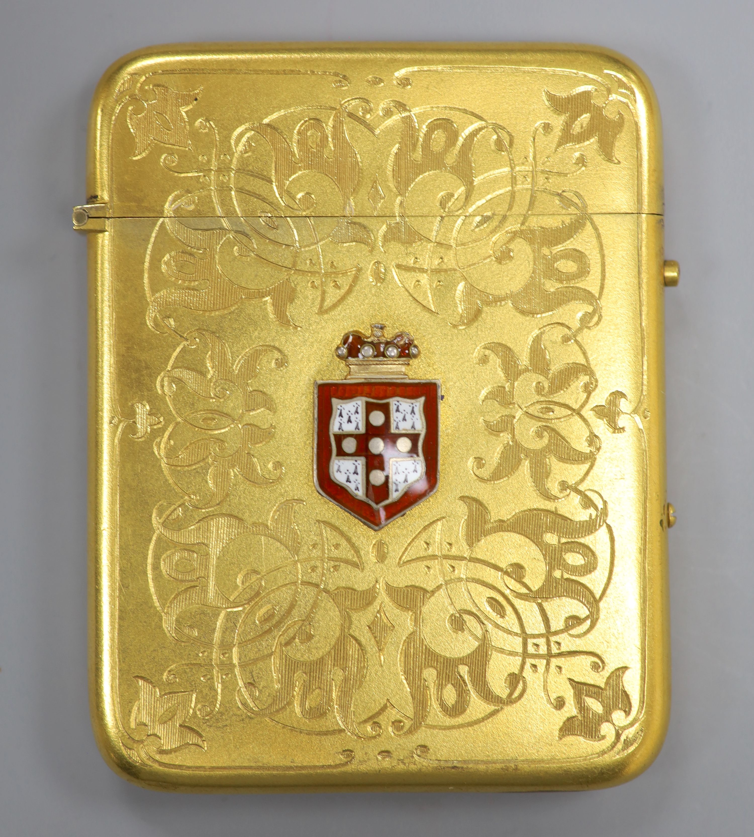 A gilt metal card case, with enamelled armorial badge, 10c,
